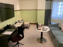 Since it is a Studio, the half of the section has a sofa, small table and a TV