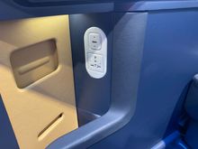 An additional USB-A and power port at the side of the seat.
