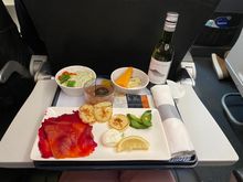 I chose Smoked Salmon salad and enjoyed it. . The starter was that same bland barley mush that I had on the way out so I didn’t eat that. Pudding was Chocolate Mousse which I swapped with hubby. 
The crew were great. Drinks came out very soon after take off with meals following shortly. About an hour before landing they came out with bottles of water and crisps  and chocolates. Nice clean plane so no complaints whatsoever. Also Lulu was sat in 1A in front of me (see the Celebs thread.)
