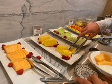 Grand Club breakfast. Some fruit options. Only berries are the ones for decoration. Yogurt appears to be a cheap variety.