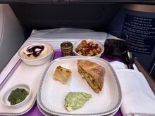 Mid-flight snack. I won’t lie, I was quite annoyed that the cabin lights were turned on as the second meal was served mid-flight. I’m a fan of big meal followed by lights off with a light mid-flight snack with lights on and a second, full meal a couple of hours before landing. Timing complaints aside, the meal was just average at best. Definitely not good enough to wake up for!