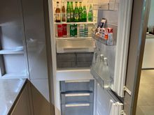 Very good size fridge, with bottom freezer and mini bar items.