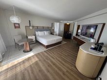I wish they renovated with a proper desk.  It does has a better lighting with extension cord snake around the ceiling to the wall behind bed wall.
