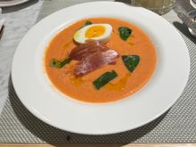 Chilled salmorejo soup with jamon serrano, soft egg and basil