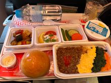 first meal…ground beef and lentils, scrambled eggs, some kind of greens and carrots. best thing about it was the Yuzu sorbet, top right. meal was…not great. FA blanched a bit when I asked her to bring the gin and tonic with my muslim meal, but delivered all with a smile. service was excellent, even if the food wasn’t.