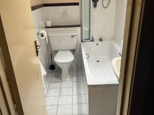 placard by the shower head is a reminder to close the bathroom door when taking a shower “as the steam may escape into the bedroom and activate the smoke alarm”