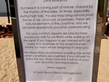 In a less euphemistic way: Better stay of the front of beach in order not to smear your body with sludge-style stuff.