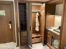 Left: door to corridor hallway
 Right: closet space and refreshment centee