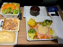 Salmon bowl was tasty as others have reported. Nuts and roll were both warm, chocolate cake was not warmed but still yummy.  Everything on one tray and snack basket never appeared.