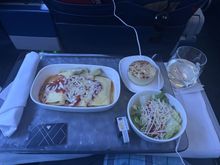 Three cheese manicotti with a salad.