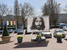 Several huge billboards in front of hotel announcing the event.