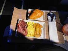 AS 188 ANC-SEA 1/2/24 Scrambled Eggs and Bacon with Roasted Potatoes, Croissant and Strawberry Jam. Light but filling. More than I could eat after stuffing myself at the ANC AL before the flight.