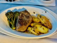 Grilled beef fillet, broccolini, roasted fingerling potatoes, herb butter