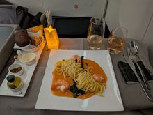 Decided to order the lobster sauce linguine as I had the cauliflower steak last time, and I had plenty of chicken in the lounge pre-flight. The passenger next to me got the chicken however and it looked amazing.

It was very well-presented and tasted okay. Both the noodles and shrimp were on the well-done side but I wouldn't call either overcooked. The sauce was 'okay'. Had a fairly mild taste of lobster but you kind of really had to look for it.