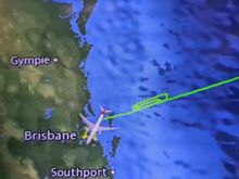 Glory be, we have done the requisite number of loops, but to BNE it is because SYD has a curfew. 

I watched Cocaine Bear to pass the time. Riotously funny when you're half-pissed on G+Ts. The crew happily topped me up and they handled things very well, particularly the grumpy pax.

It was pretty awesome to be doing circuits at 10,000ft at high throttle. I noted some lights which I presumed to be ships in the Tasman Sea, so I hope they weren't too concerned about what they may have seen. 