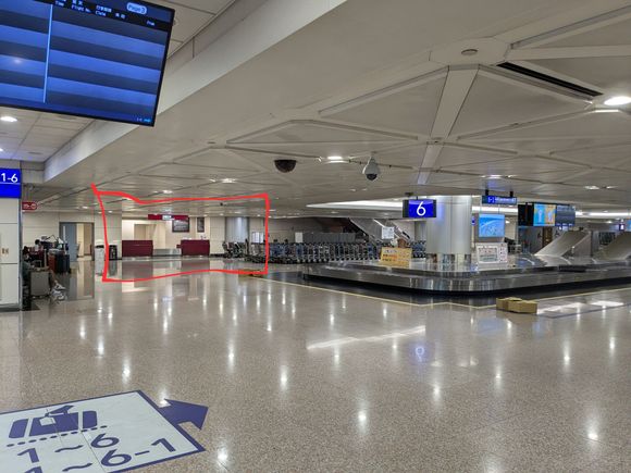 Left luggage at far end of baggage claim