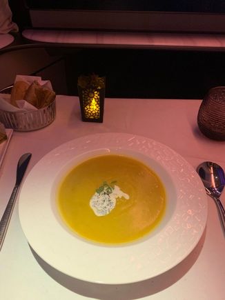 Pumpkin soup, perfect serving temperature and spice.  It's amazing how disgusting soup course tends to be in international J/F, especially AA and CX.