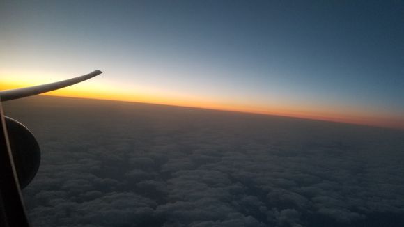 Sun setting under the 77W wing