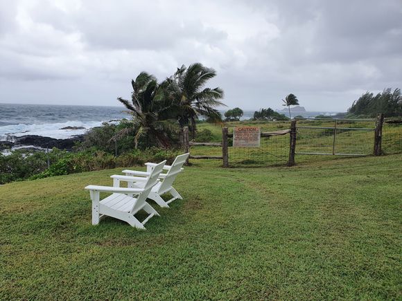 At least a dozen chairs like this are scattered just above the shore.