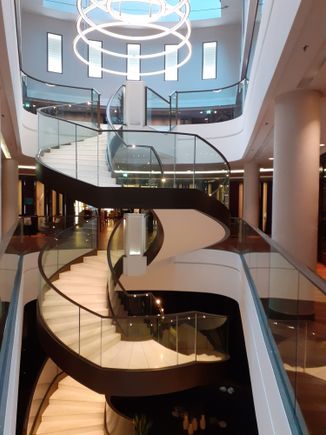 Staircase from ground floor  to 1st and 2nd floors ( breakfast area in background on 1st floor)