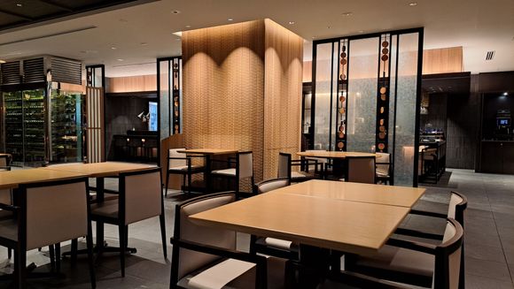 View of the dining area. Breakfast items are put on the counter in the distance. Quite quiet when i was there but service was very good.