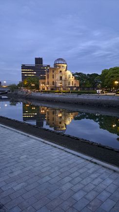 The A-dome building seen at dusk from across the river. The river was beautiful and still  ( a cruise boat passed by a minute later and created waves). Dusk and nighttime in the peace park has a different atmosphere than during the day)