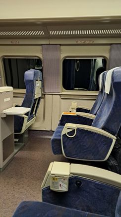 Seats on the  kodama Shinkansen ( going though a tunnel). Space for oversize luggage in front of  row 1 ( only 1 seat on row 1)