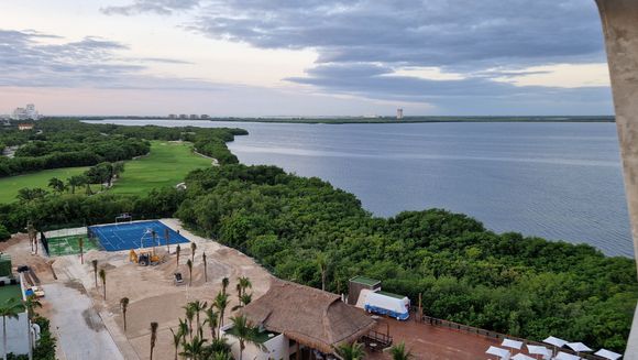 view facing the bay with sunset views, and if you enjoy watching aircraft land at CUN airport
