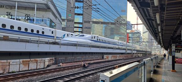Two shinkansen trains passing whilst  i was waiting on the JR lines