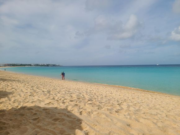 Those white buildings at the far left are the Four Seasons hotel where I went snorkeling - the guy took me with the motor boat below. 