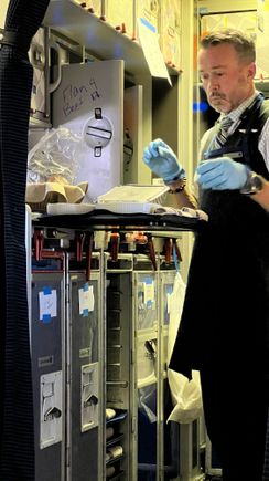The look on the FA preparing the meals is priceless. 