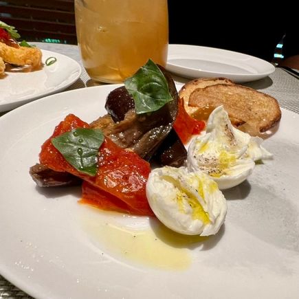 Buffalo mozzarella with marinated eggplant and roast tomatoes.