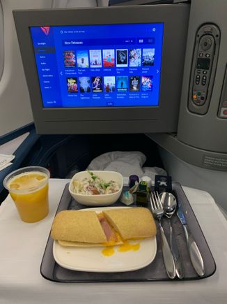 No change with pre-arrival meal: choice of hot ham and cheese sandwich with salad or cold grilled chicken salad with potato salad side