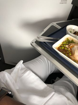 Plenty of room to exit the seat when the table is set with your meal - it retracts to a halfway stop