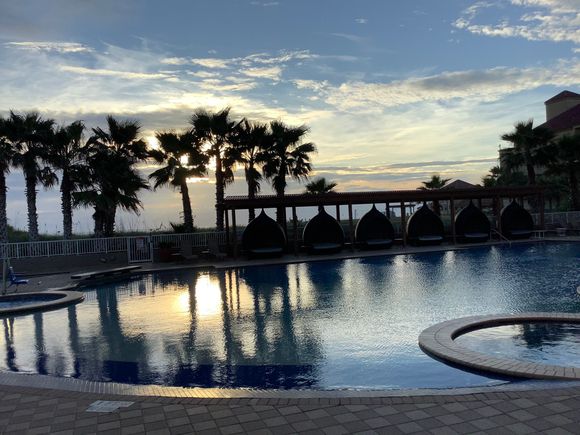 Sunrise over pool and Gulf of Mexico 