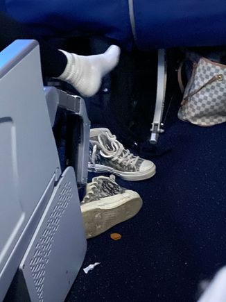Landing - video screen out, bag not under seat and shoes sitting means no free egress