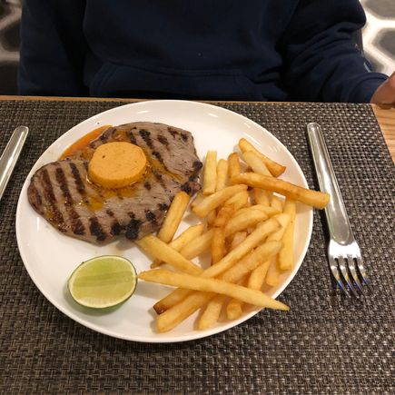 Black Angus minute steak with chipotle butter, lime and fries