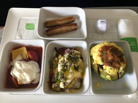 Clockwise from top: chicken sausage, grilled & chilled avocado, potato roesti, plum clafoutis
