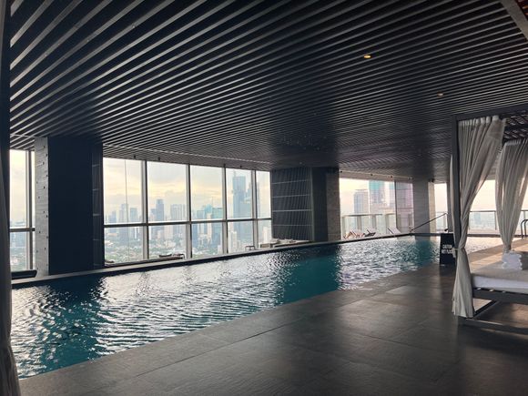 The pool seemed to be warmed! Has cabanas and a smaller warmer kids pool on the further end. Could order from the Conservatory menu as well. 