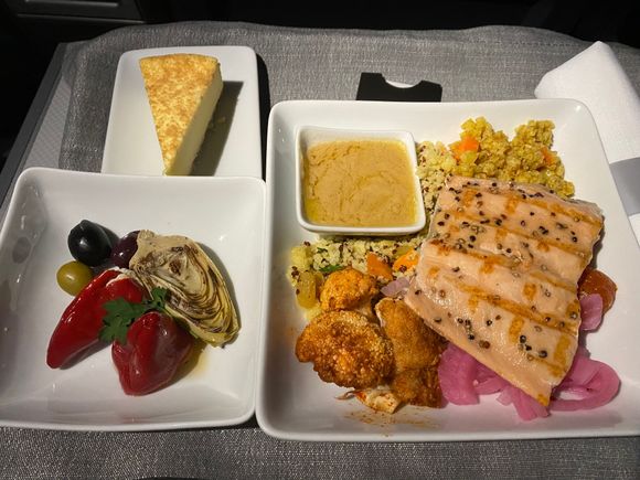 I had a quinoa dish with grilled salmon.    The sauce was mustard-y & absolutely delicious!   I drenched everything in it.    Dessert for us both was a cheesecake.  