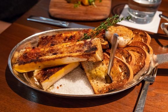 Roasted bone marrow, a standby at Blue Duck. This time, it was served with bourbon butter and pretzel crumbles with roasted garlic. Tasty and quite filling, as usual.  I do prefer when they season it a bit more strongly (the bourbon butter was too subtle), but smearing the roasted garlic atop each slice of toast did give plenty of flavor.