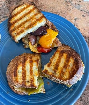 I used leftover balsamic roasted veggies from the Super Bowl and sharp white cheddar and made paninis with olive oil rosemary bread. Pretty tasty. 