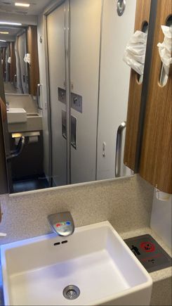 Nice bathrooms with a full length mirror on wall side
