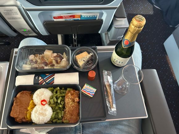 Chicken ‘gado-gado’, Waldorf salad, cheese and bottle of cava. Not sure if champagne will be offered when the worldwide shortage which seems to affect KLM only is over next month? 
