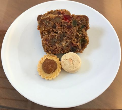 Homebaked fruitcake , sugee cookie and pineapple tart baked by another childhood friend 