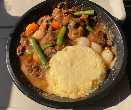 Red wine beef and vegetables served with polenta. Served approximately 12:30 pm, 3.5 hours into departure. 