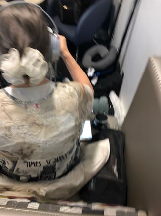 Not the best shot, I had to be sneaky. But notice the Bose headset plus the little black noise machine on the right. 