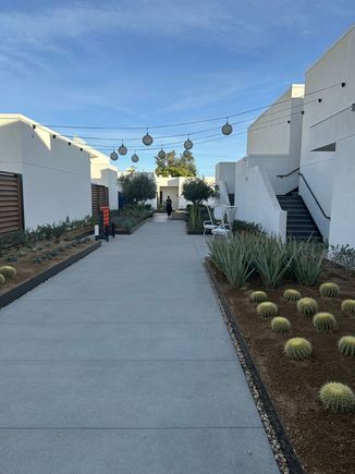 An example of the nicely landscaped paths around the second floor. Rooms on the right side include some walk-up rooms on the third floor.