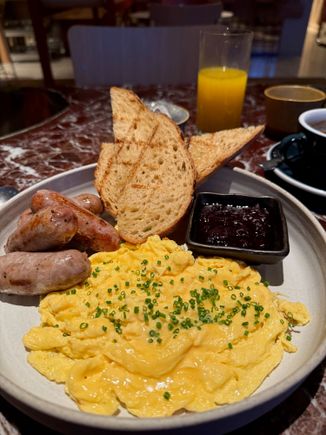 Eggs on sourdough with sausages breakfast at Bang