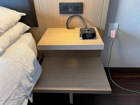 Very convenient nightstand on both sides of the king bed, with plenty of space for electronic devices.  One side also had a phone, while the other side (shown here) has an alarm clock with additional AC and USB-A outlets.